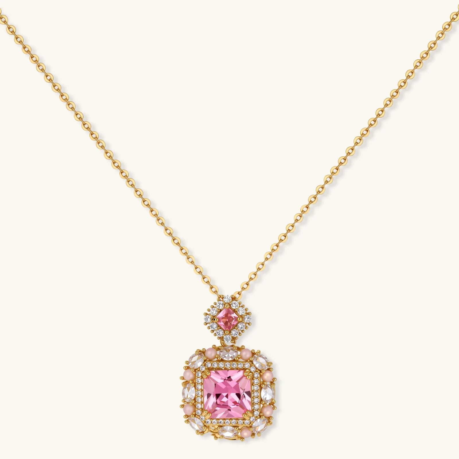 14K gold-plated jewelry set featuring square-cut cubic zirconia stones in ornate layered settings on white background.