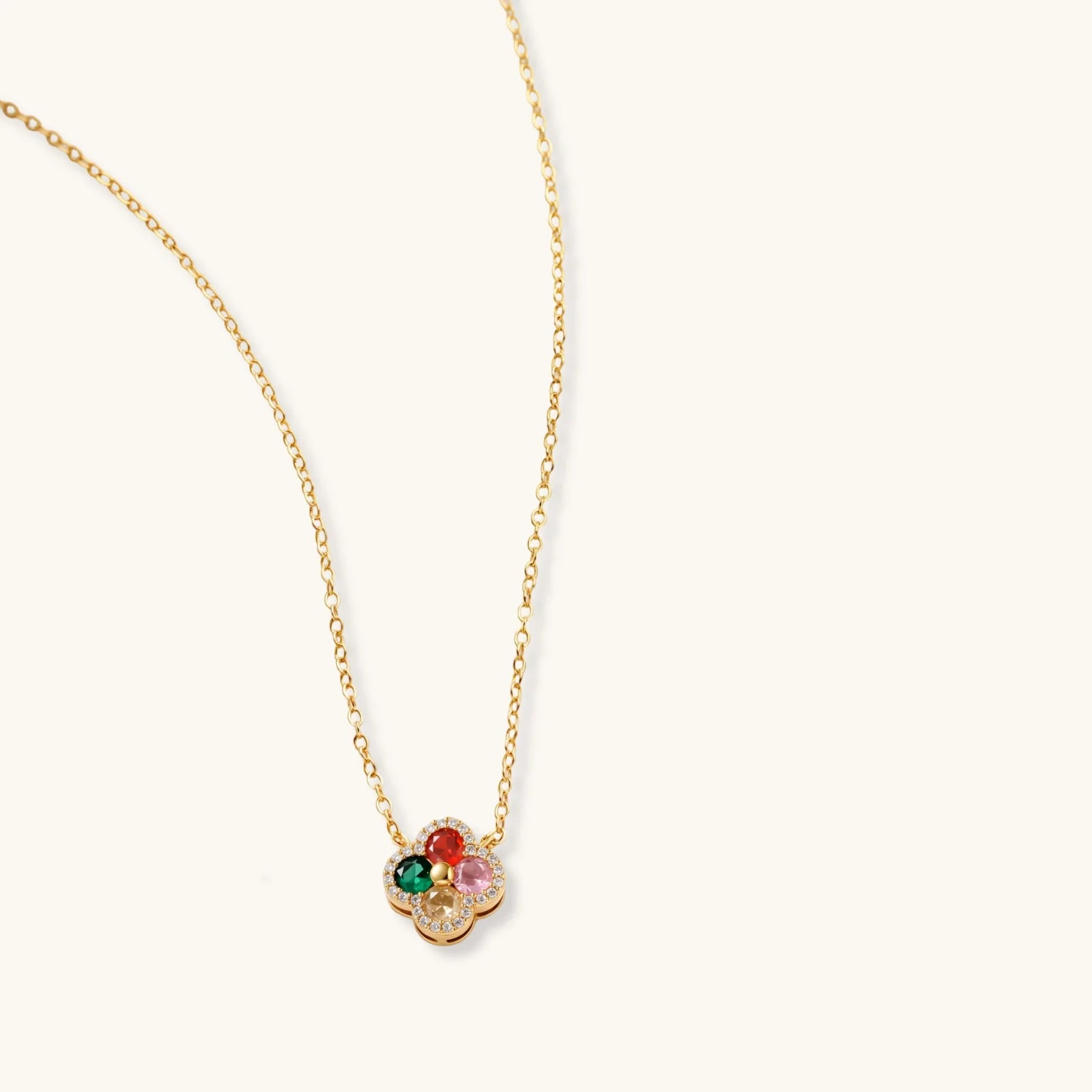 Gold-plated clover jewelry set with red, pink, green and champagne CZ stones surrounded by crystal borders