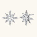 Sterling silver star-shaped stud earrings with brilliant moissanite center stones and pavé details on neutral background.