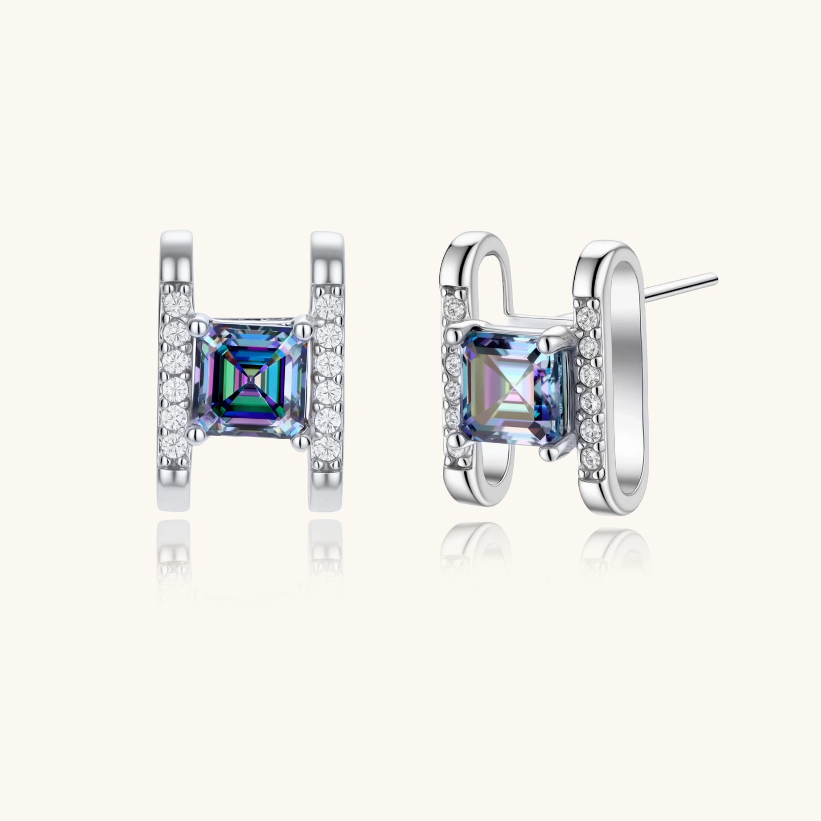 Square moissanite studs in sterling silver geometric setting showing rainbow prismatic fire on white background.