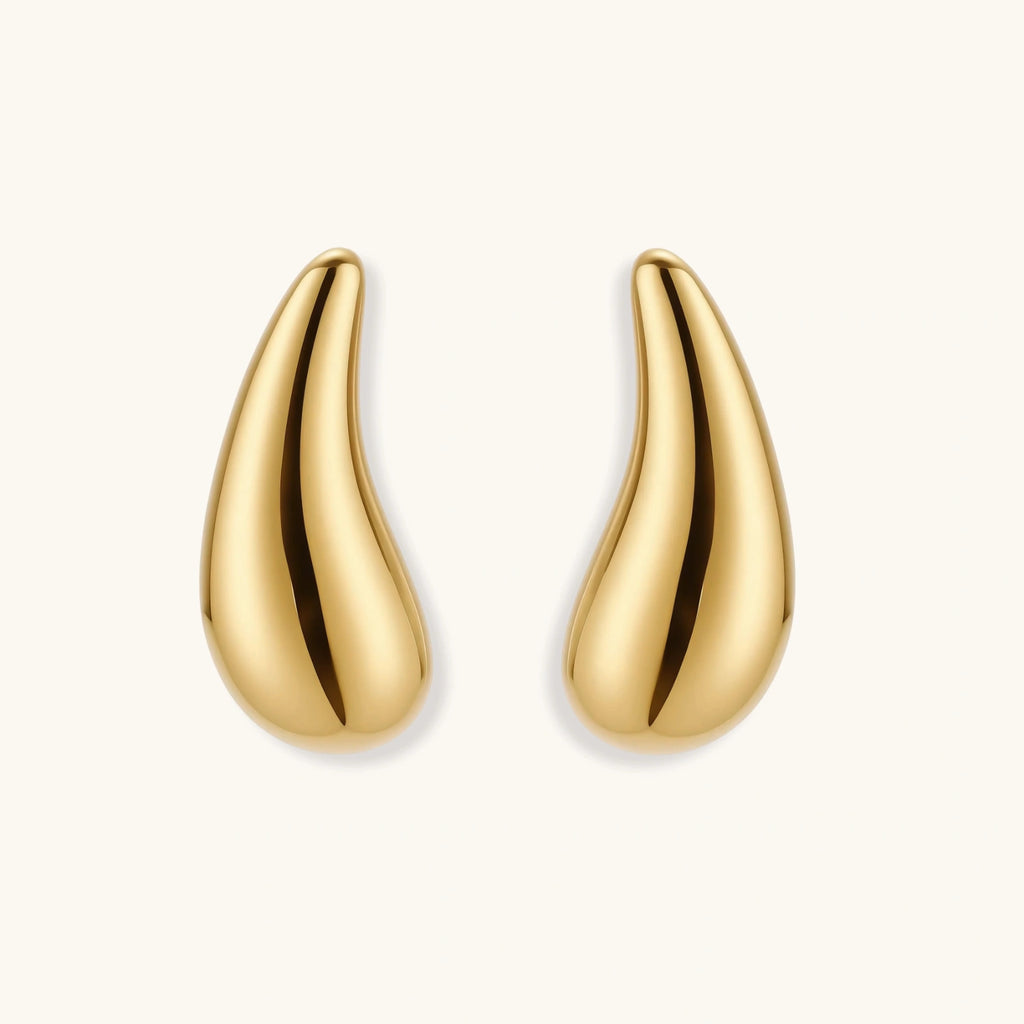Pair of gold-plated sterling silver teardrop stud earrings with polished finish on white background.