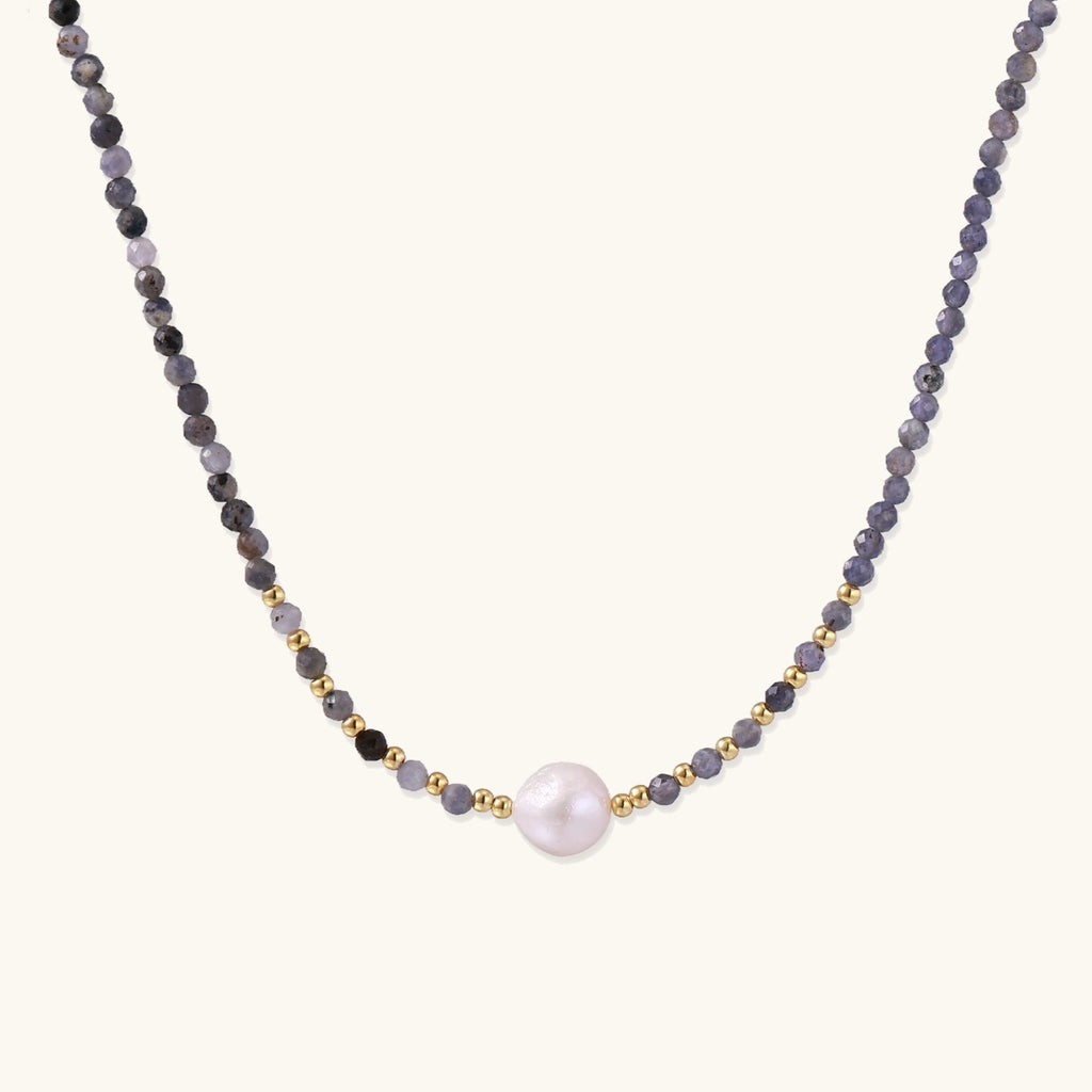 Dainty necklace with faceted purple iolite beads, gold vermeil accents, and central pink-white freshwater pearl.