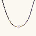 Dainty necklace with faceted purple iolite beads, gold vermeil accents, and central pink-white freshwater pearl.