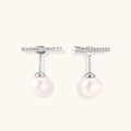 Rhodium-plated sterling silver ear jacket earrings with diamond-set horizontal bar and freshwater pearl drop
