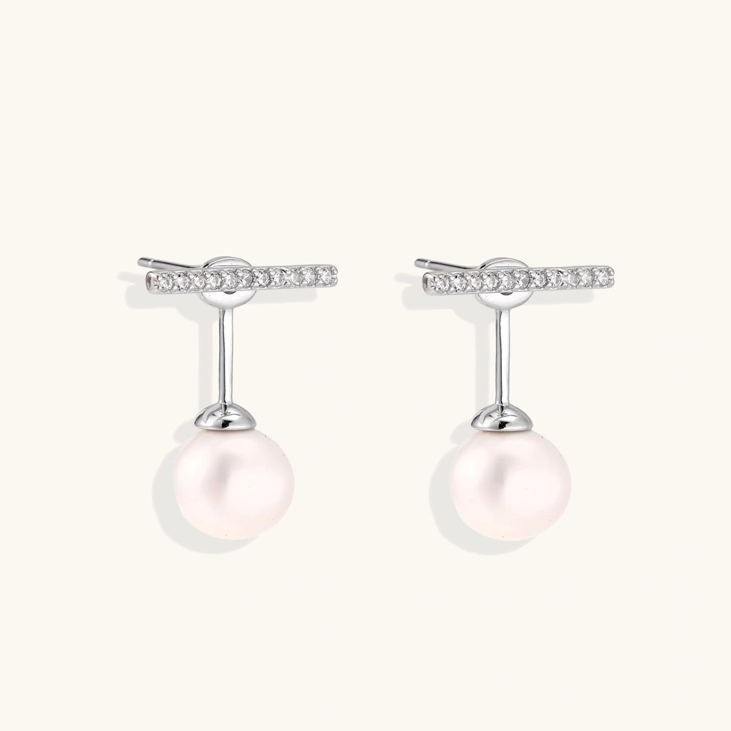 Rhodium-plated sterling silver ear jacket earrings with diamond-set horizontal bar and freshwater pearl drop
