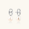 Modern rhodium-plated silver earrings with geometric double-circle design and freshwater pearl drops