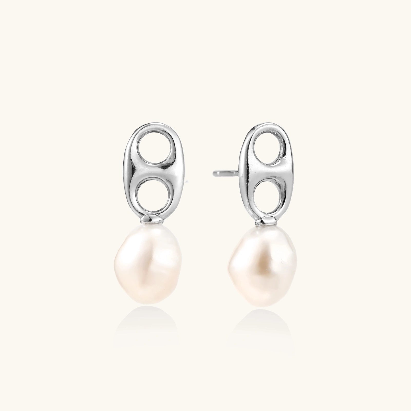 Modern rhodium-plated silver earrings with geometric double-circle design and freshwater pearl drops