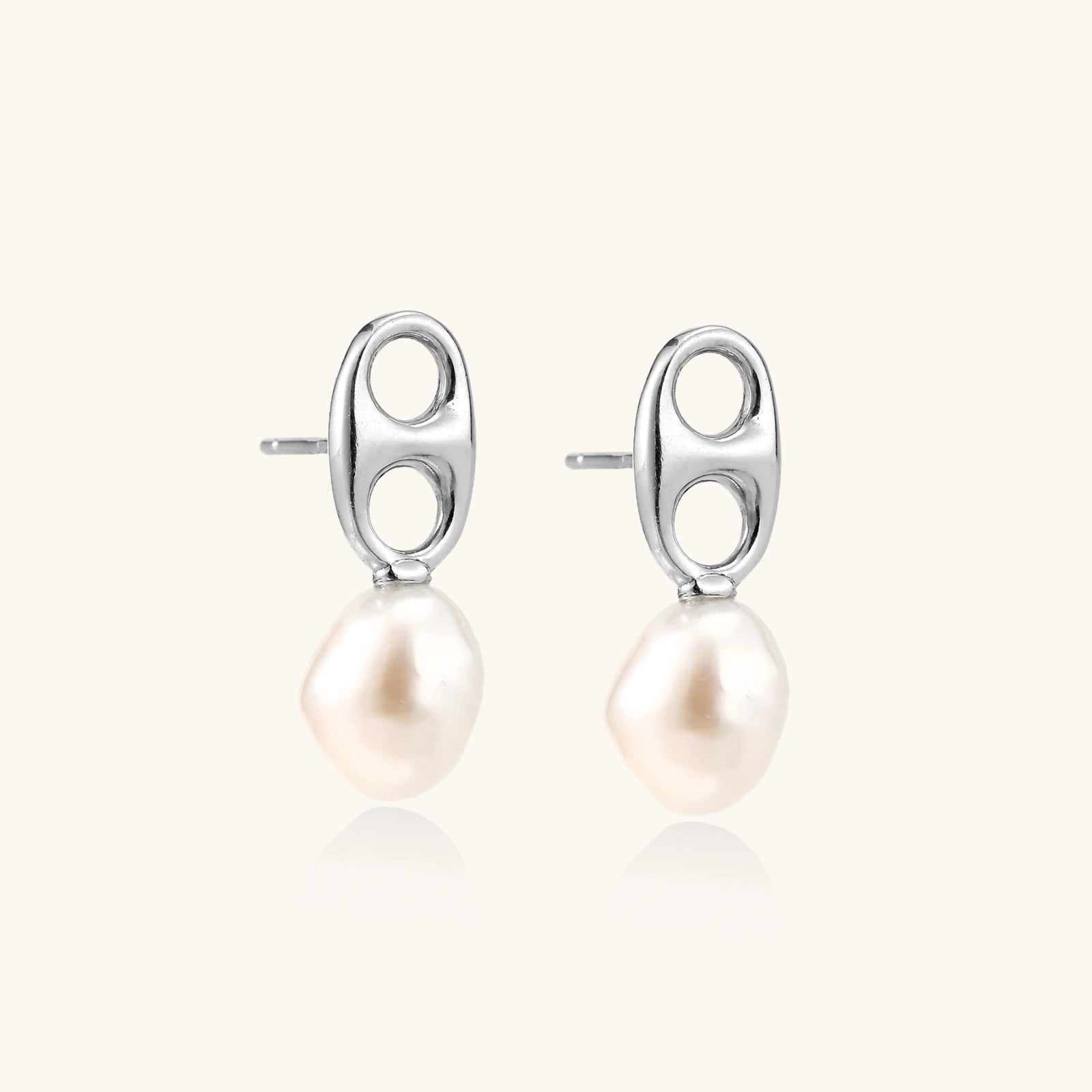 Modern rhodium-plated silver earrings with geometric double-circle design and freshwater pearl drops