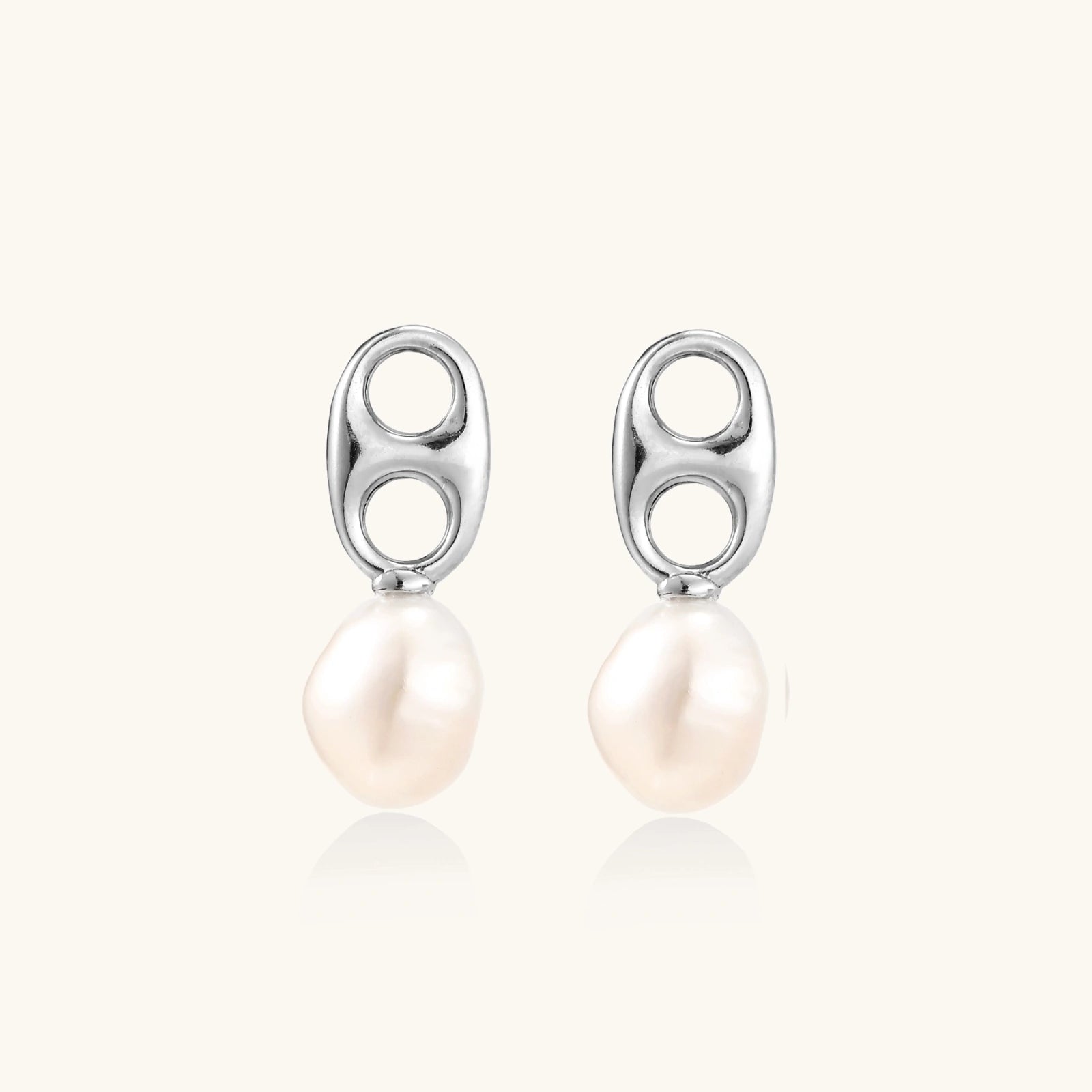 Modern rhodium-plated silver earrings with geometric double-circle design and freshwater pearl drops