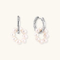 Rhodium-plated silver hoop earrings with freshwater pearls arranged in crescent formation and diamond accents