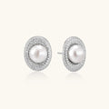 Elegant stud earrings with cream freshwater pearls surrounded by sparkly pavé crystals on rhodium-plated silver setting