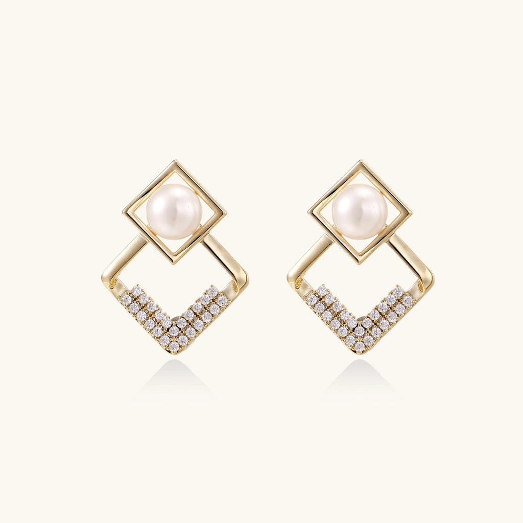 Gold-plated double square frame earrings with freshwater pearl and crystal accents on white background