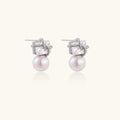 White gold stud earrings with square crystal stones in twisted frames and pink freshwater pearl drops below