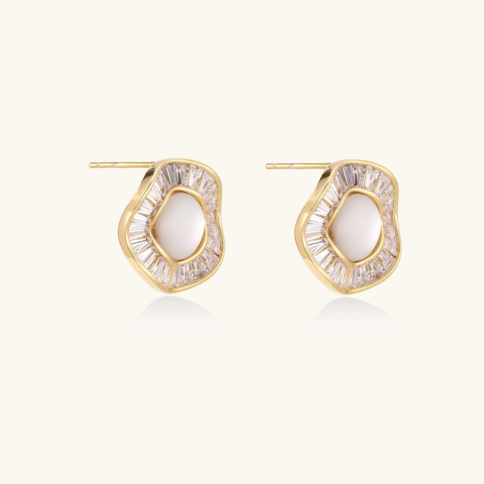 14K gold-plated stud earrings with freshwater pearl center surrounded by baguette-cut crystal halo in sunburst design