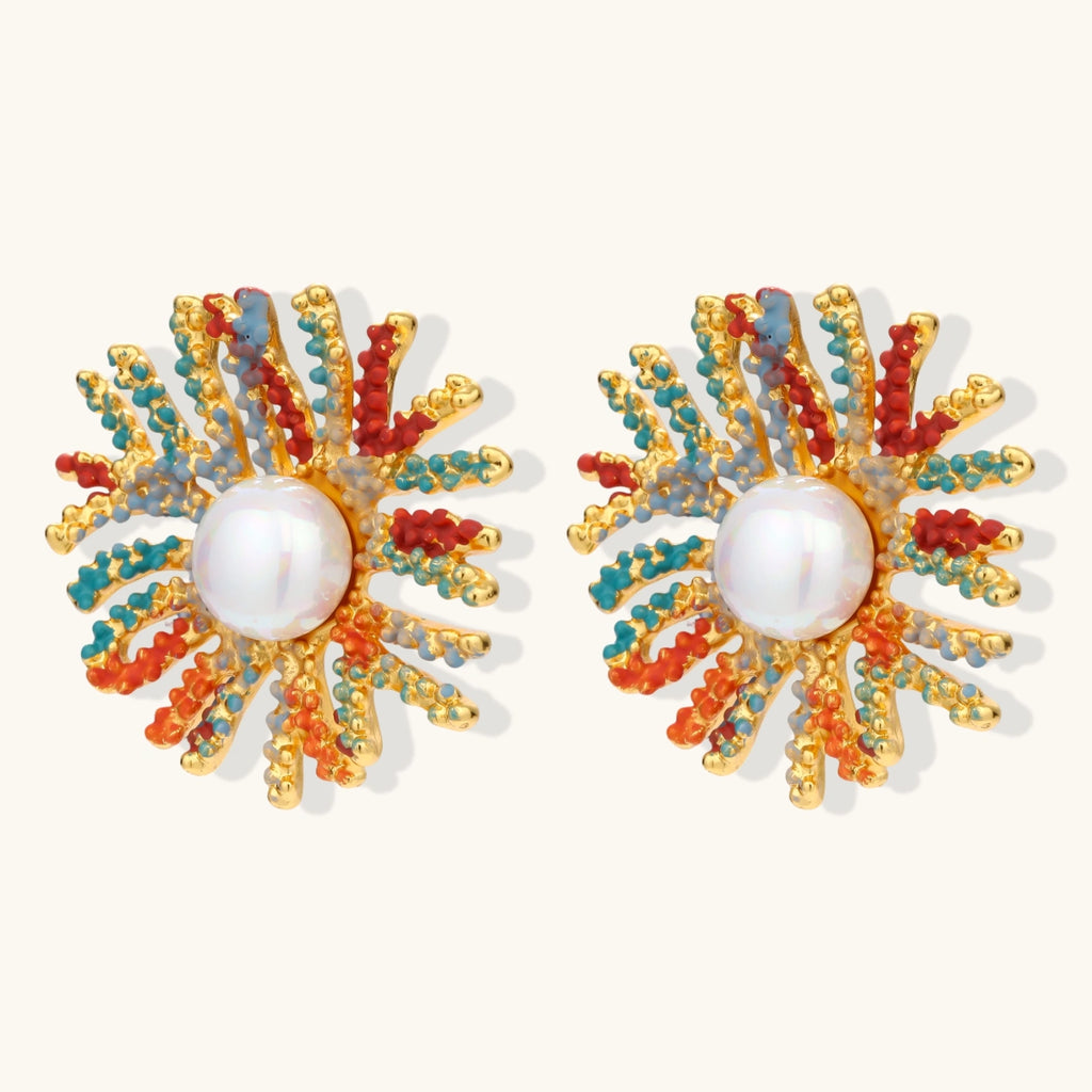 Vibrant starburst stud earrings with multicolor enamel rays and white pearl centers on gold-plated setting
