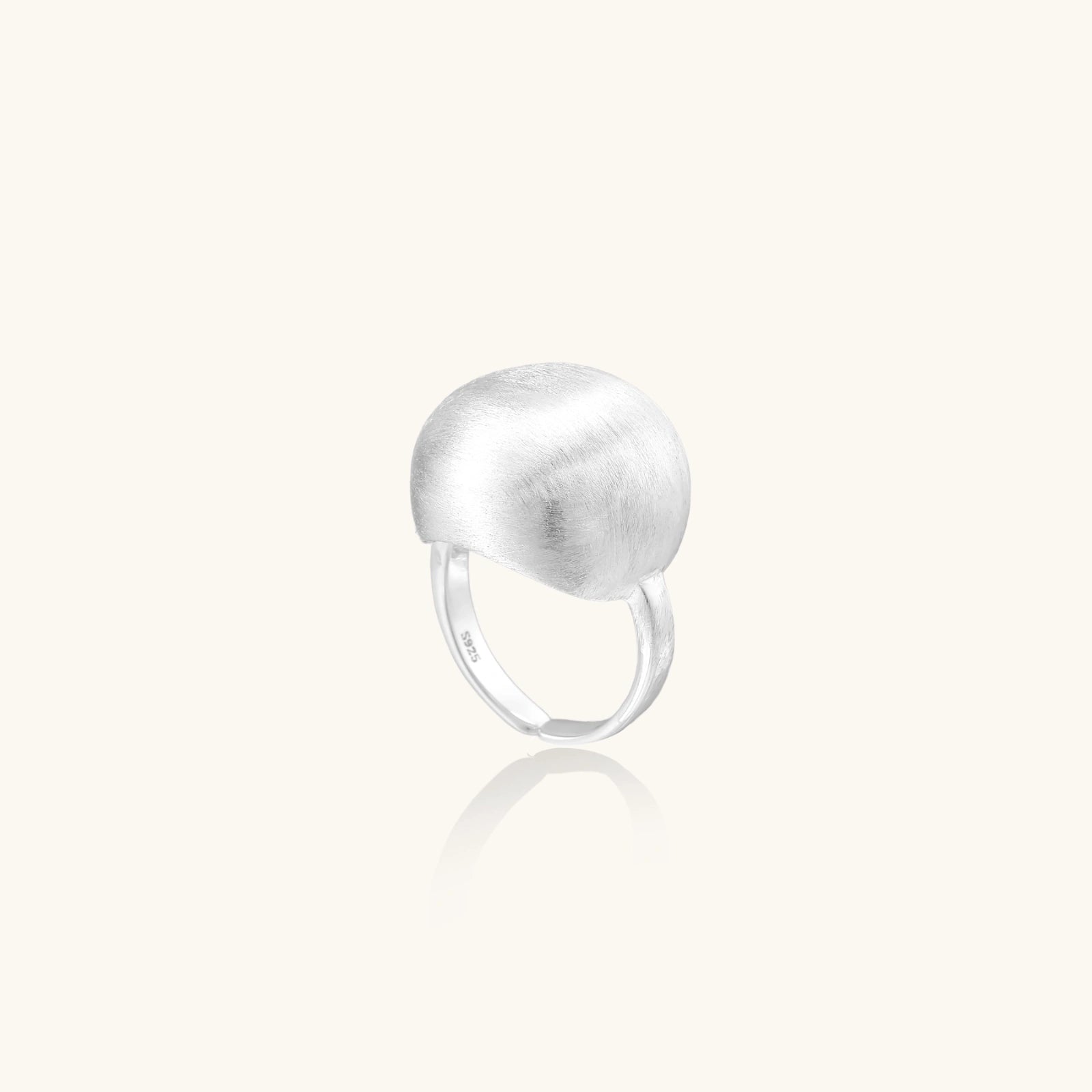 Minimalist brushed sterling silver dome ring with adjustable band on white background, front view.